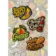Assorted vibrant stickers with flavor names: Banana Purple Punch, Cherry Cola, Guava, and Apple Strudel.